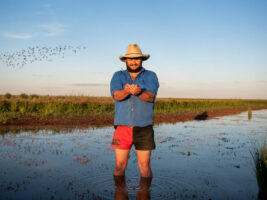 Man standing in wetlands